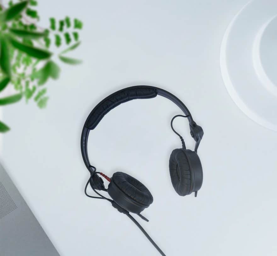 black corded headphones on white table